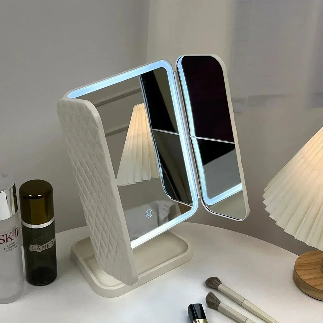 Sleek Tri-Fold LED Vanity Mirror, a beauty tool with 3 adjustable light colors for detailed makeup application.