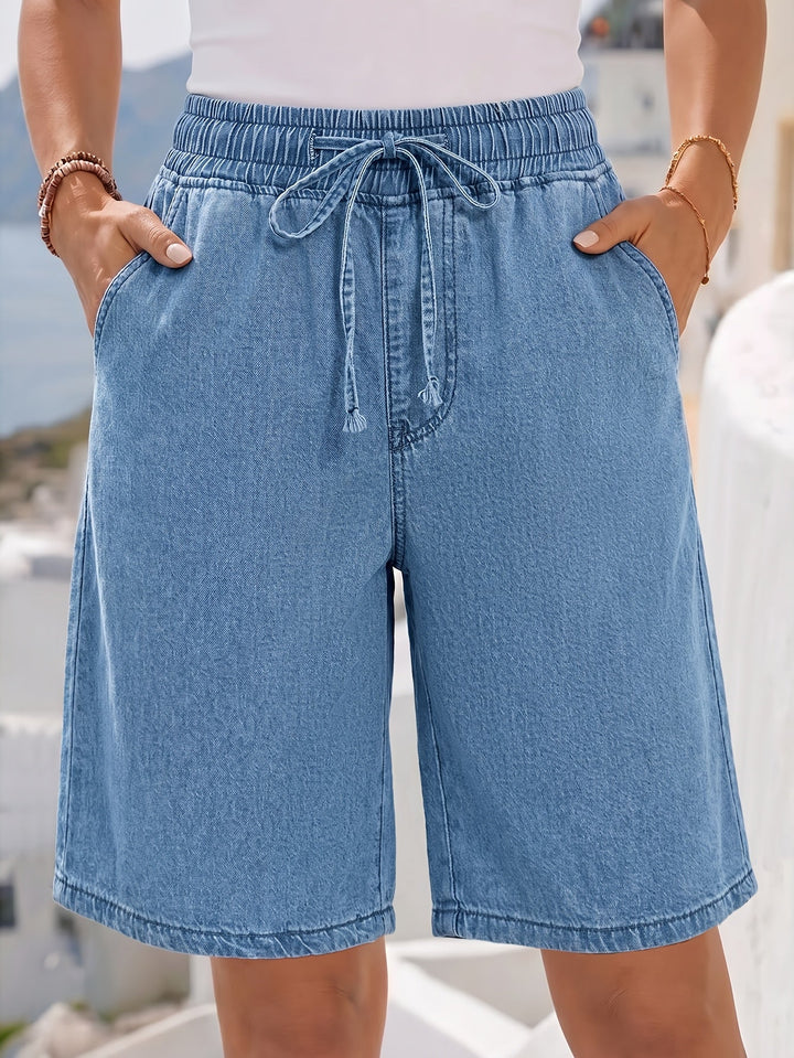Relaxed fit wide-leg light blue women's bermuda shorts, featuring an elastic drawstring waist for everyday comfort.