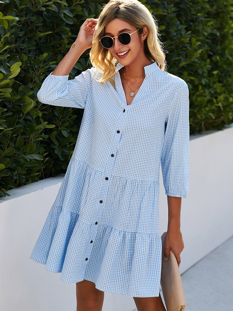 Light blue women's gingham tiered mini dress with a chic button-down front, perfect for summer casual wear.