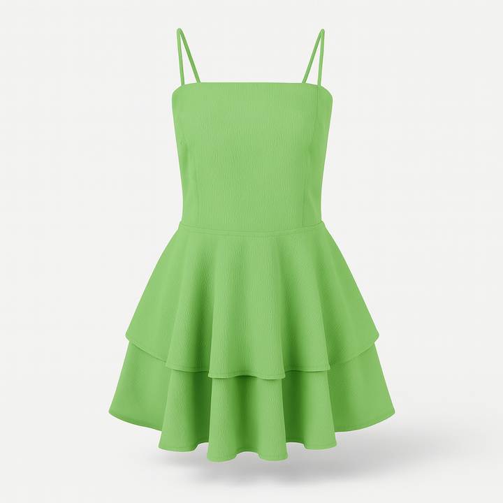 Light green women's ruffle mini dress with delicate spaghetti straps, perfect for summer events.