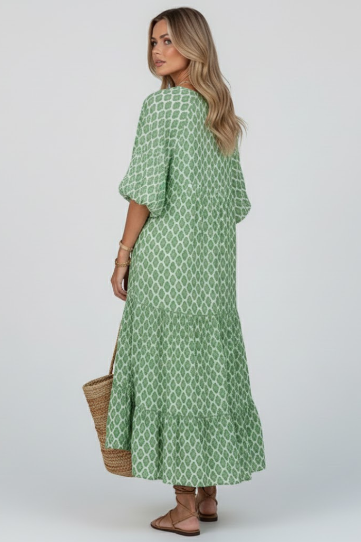 Stylish women's summer maxi dress with V-neck & short sleeves. Features a comfortable flowy light green design.