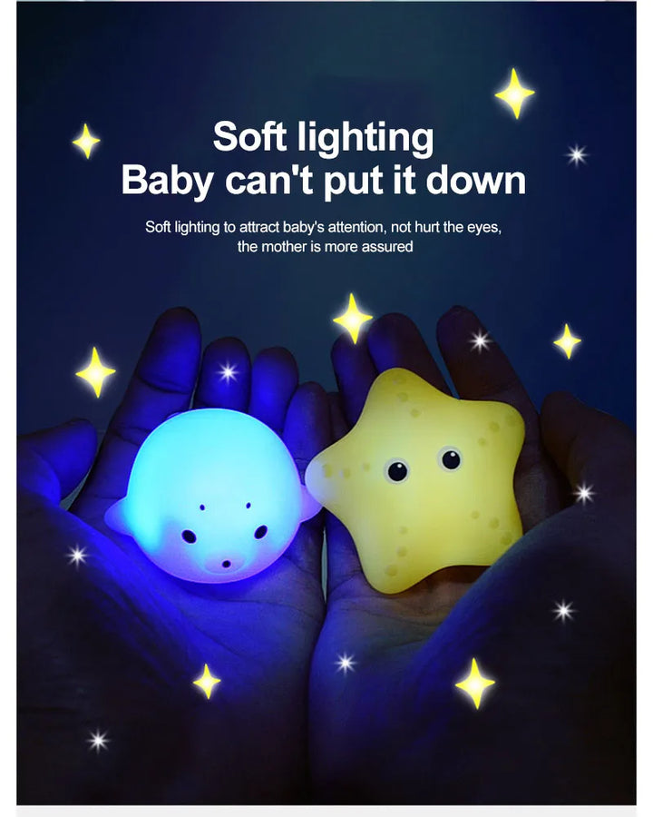 Smiling child enjoying sensory play with a light-up elephant bath toy
