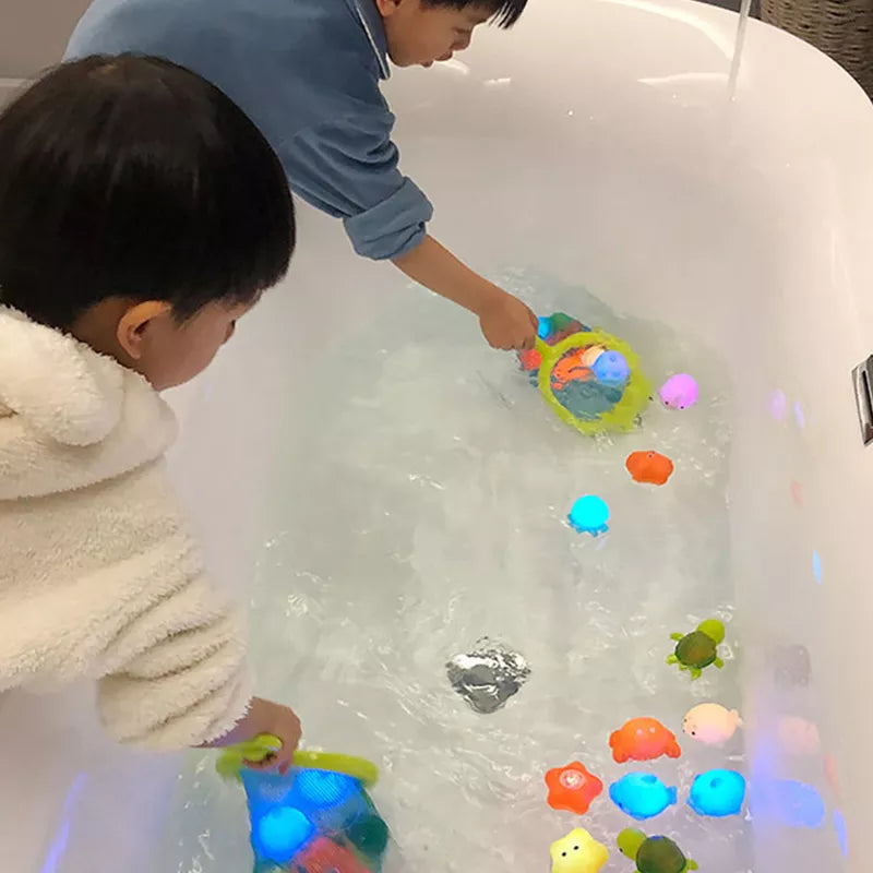 Close-up of a vibrant, color-changing fish bath toy, loved by babies