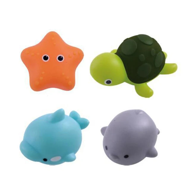 Child happily playing with multiple light-up animal figures in the bath
