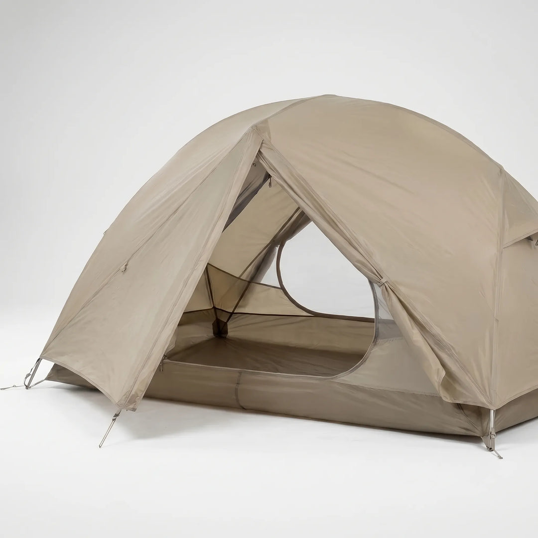 Freestanding, water-repellent 3-season hiking tent set up in an outdoor camp.