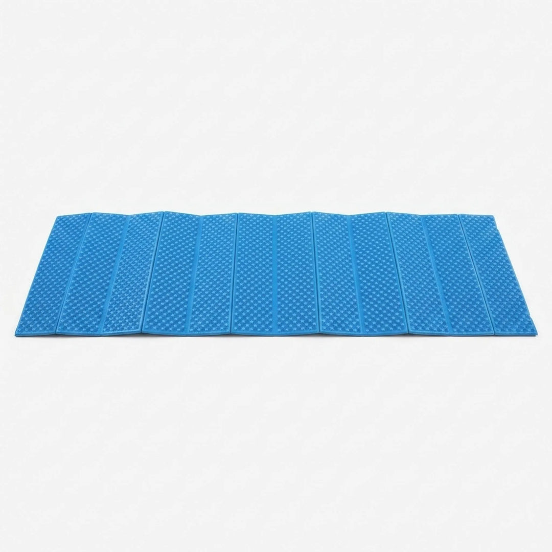Folded lightweight camping mat, showing its compact size for easy portability. Outdoor sleeping pad.