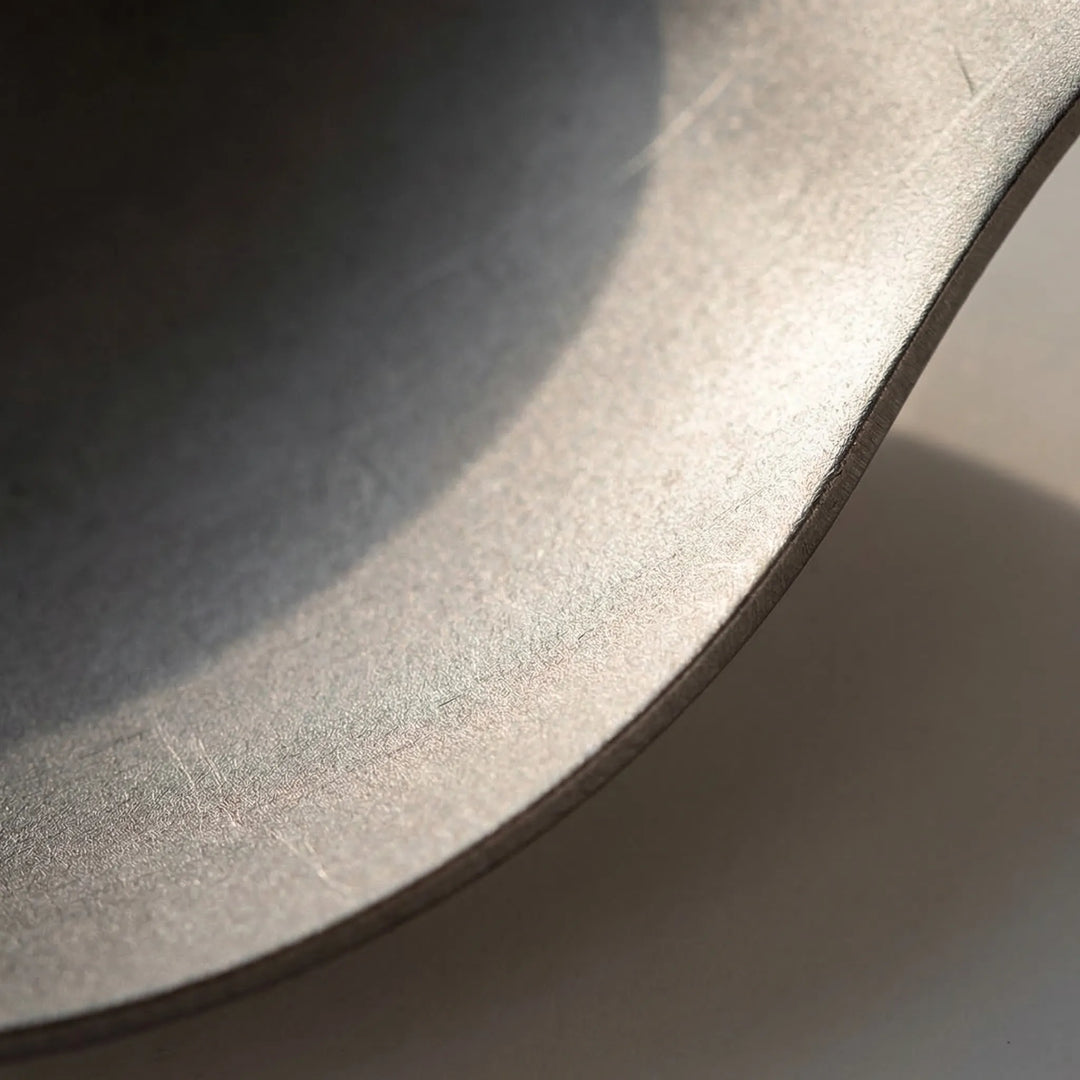 Durable titanium foldable spork, ideal for backpacking, hiking, and camping. Essential lightweight outdoor cutlery.