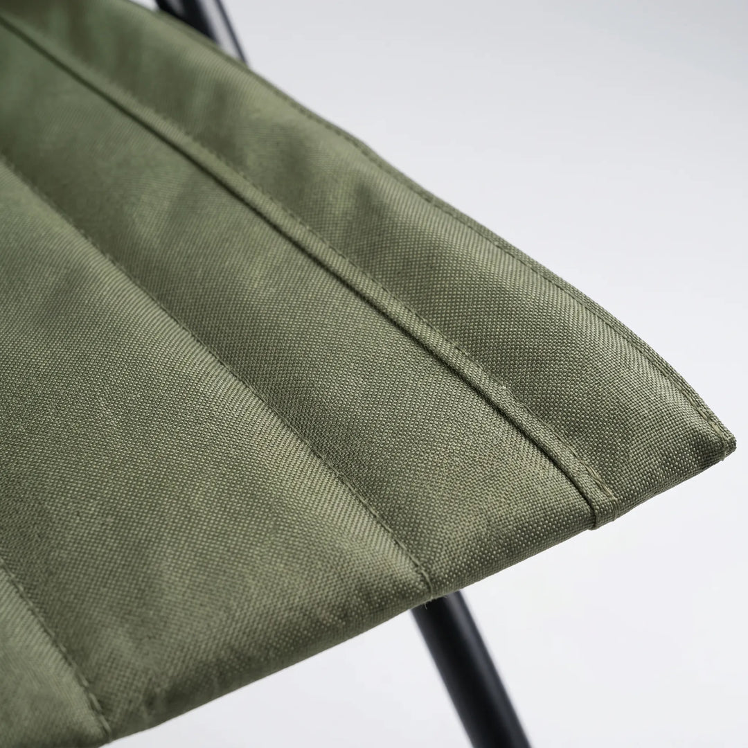 Ergonomic portable ground chair with supportive backrest for comfortable outdoor seating during sports or festivals.