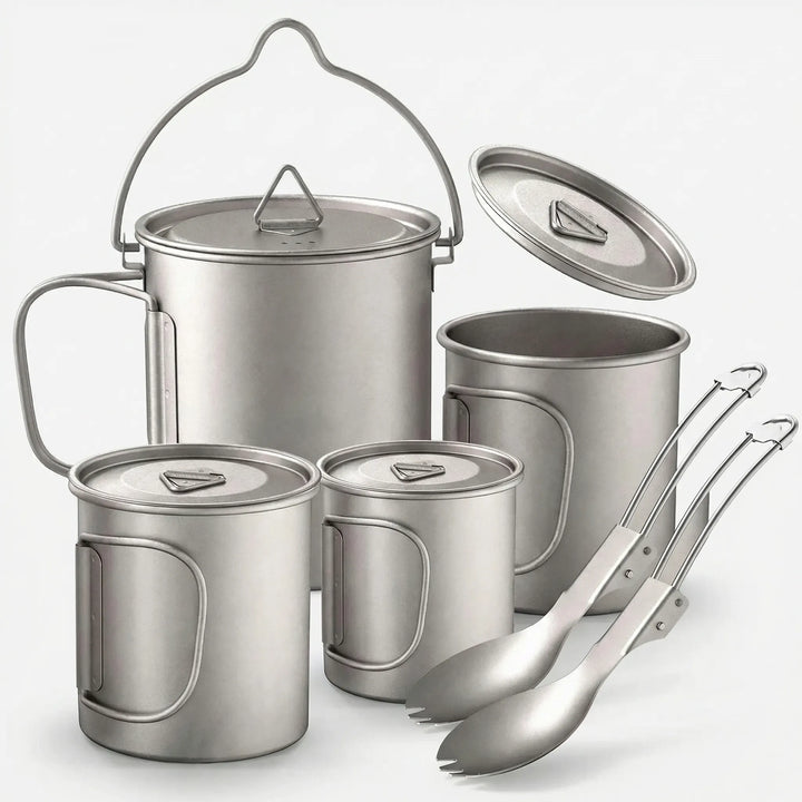 Lightweight titanium camping cookware set for backpacking, including pot, pan, and utensils, ideal for outdoor cooking.