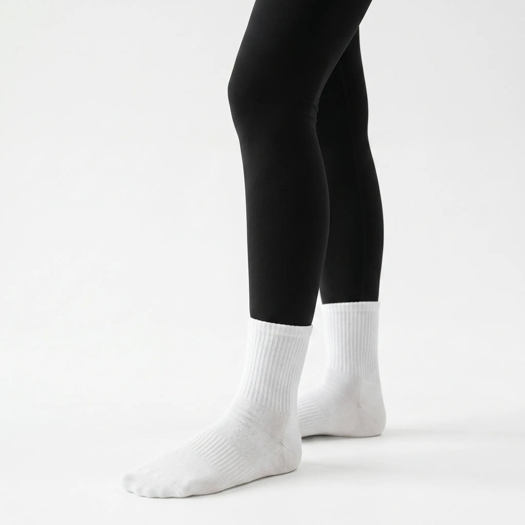 Women's non-slip grippy crew socks in lilac, ideal for studio workouts like yoga, Pilates, & barre.