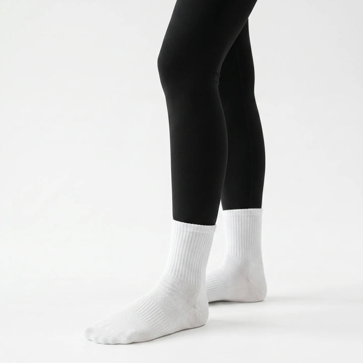 Women's non-slip grippy crew socks in lilac, ideal for studio workouts like yoga, Pilates, & barre.