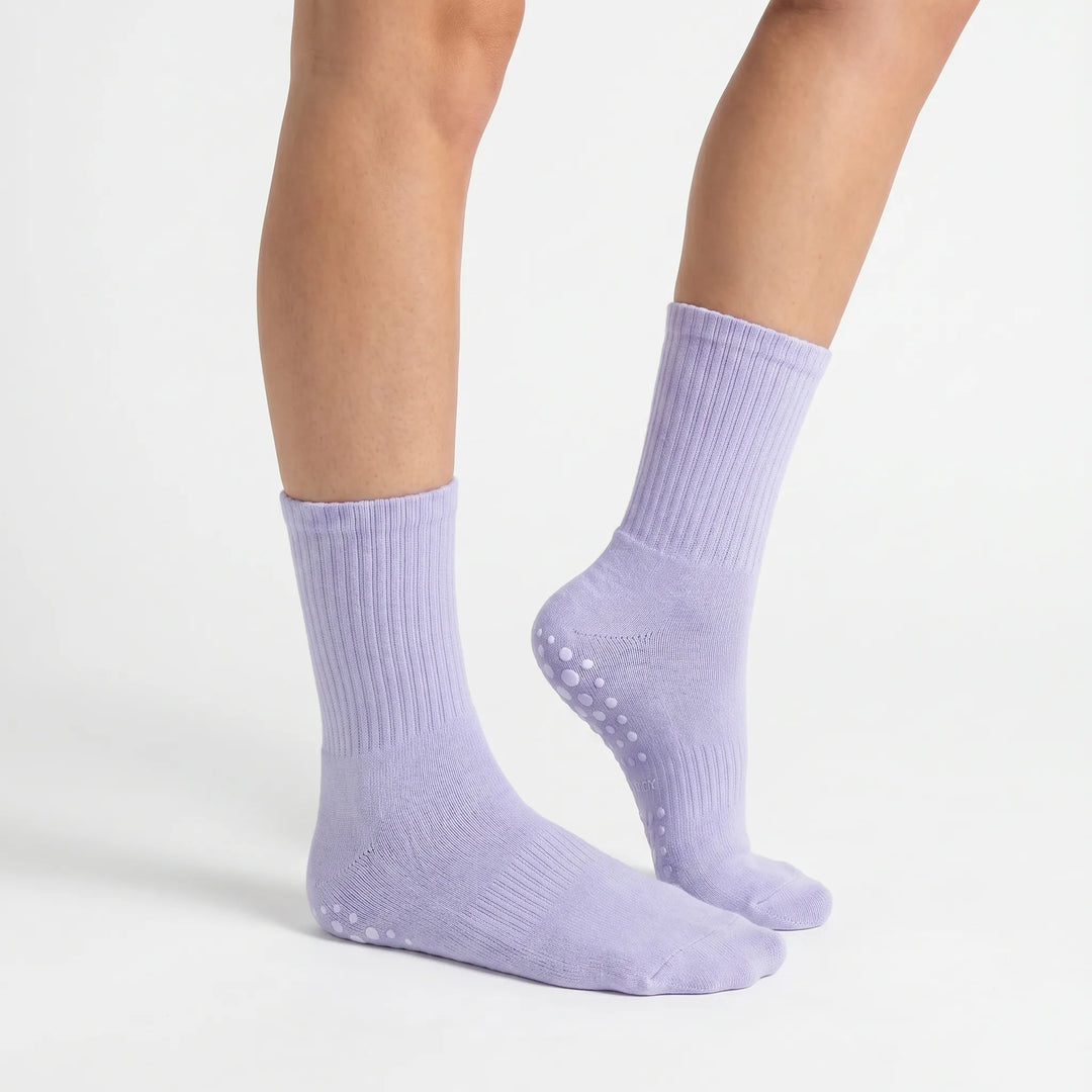 Comfortable lilac women's grippy athletic crew socks with non-slip sole for secure studio workouts.