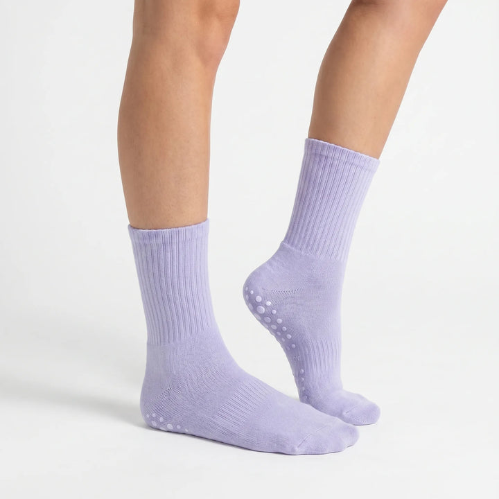 Comfortable lilac women's grippy athletic crew socks with non-slip sole for secure studio workouts.