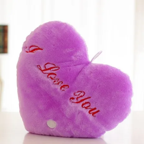 Luminous heart plush pillow, a cozy night light and comfort toy for any child's room.