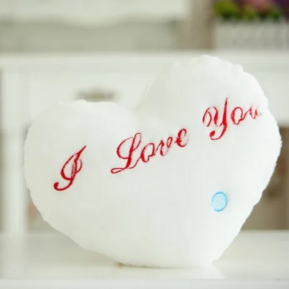 Blue luminous star plush pillow, glowing comfort item for children's bedroom, soft texture.