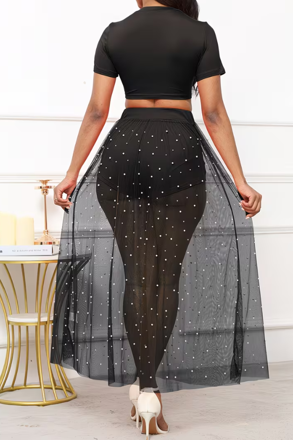 Sophisticated women's three-piece set: crop top, sheer pearl skirt, and matching shorts. Perfect for beach & resort.