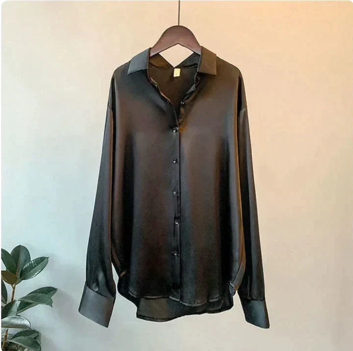 Chic women's luxurious relaxed fit button-up shirt. A classic long sleeve blouse for versatile everyday elegance.