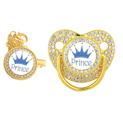 White silicone baby pacifier with a glistening gold crown, paired with a fashionable clip.