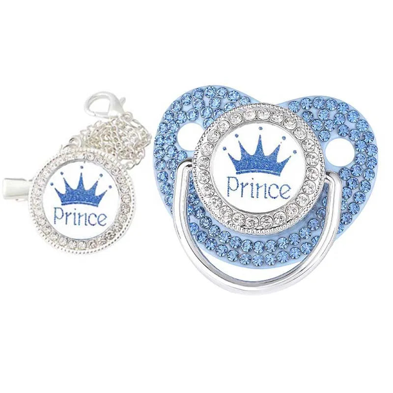 White and gold luxury baby pacifier and secure clip, ideal for infant feeding.