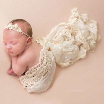 Luxury newborn baby swaddle blanket with delicate mesh lace trim, perfect for infants.