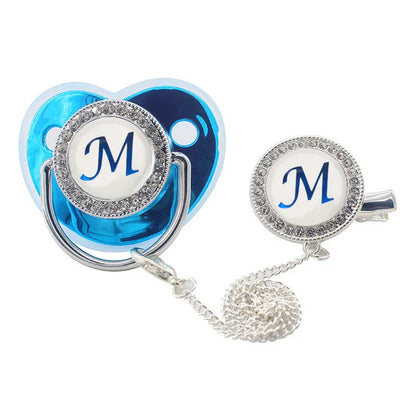 Fashionable baby pacifier, blinged out with rhinestones and a convenient pacifier clip