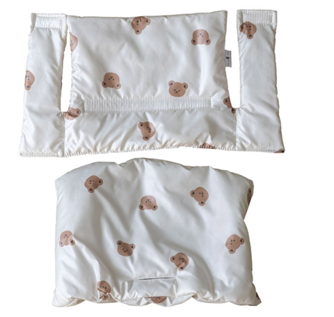 Highchair cushion in a neutral tone, designed for baby comfort and support, fully washable for easy maintenance.