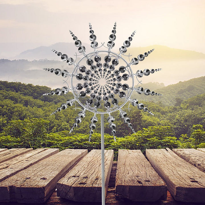 Intricate anti-rust metal kinetic wind spinner design, an outdoor ornament adding elegant motion to your garden.
