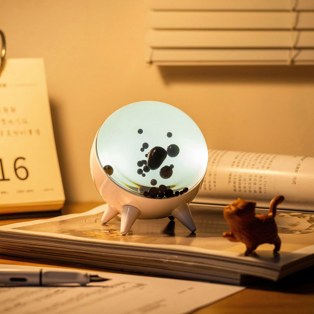 MagnePulse music-reactive ferrofluid display with dynamic magnetic liquid. Mesmerizing tech decor art.