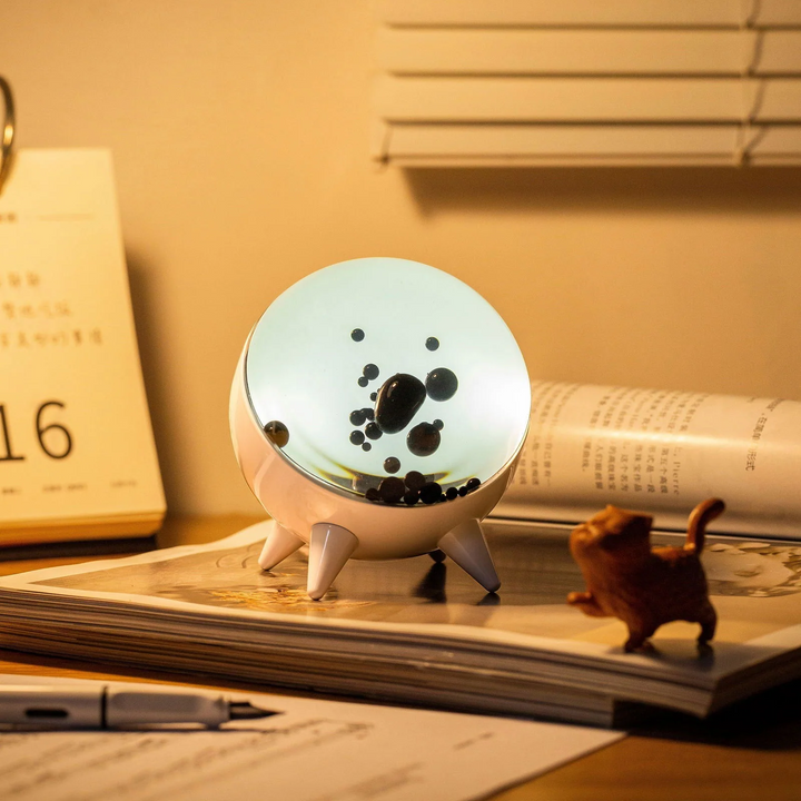 MagnePulse music-reactive ferrofluid display with dynamic magnetic liquid. Mesmerizing tech decor art.