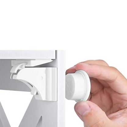 Magnetic child safety lock with key, shown installed inside a white cabinet door, invisible from outside.