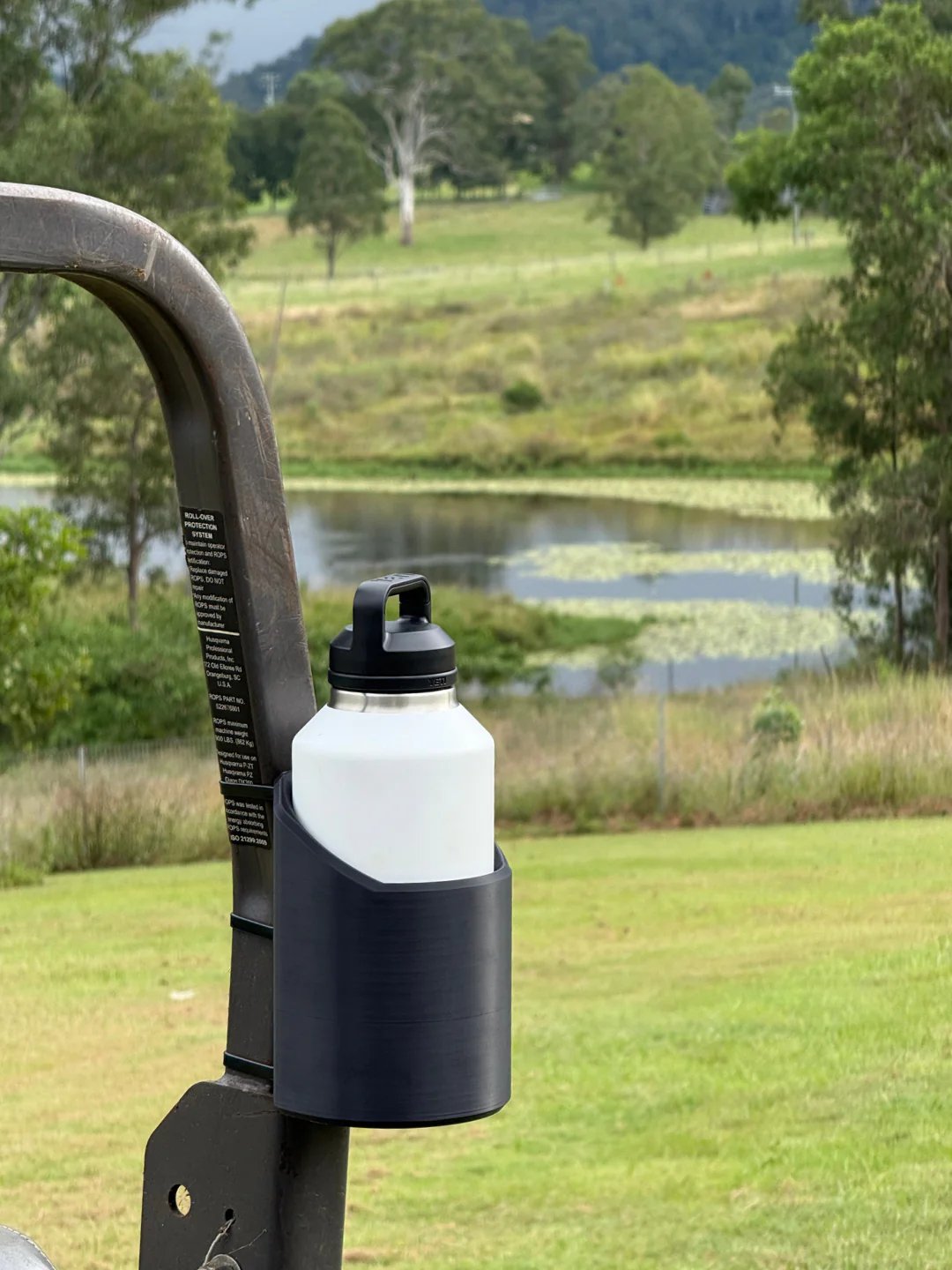 Versatile magnetic bottle mount for gym equipment, tools, or garage. Heavy-duty grip for hands-free hydration.