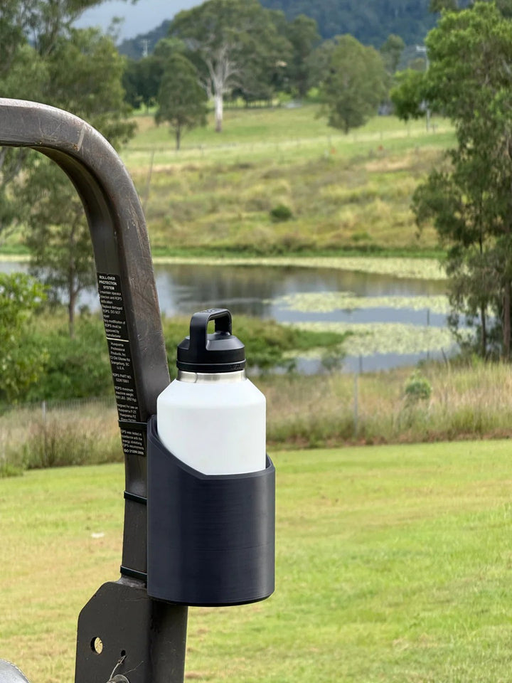 Versatile magnetic bottle mount for gym equipment, tools, or garage. Heavy-duty grip for hands-free hydration.