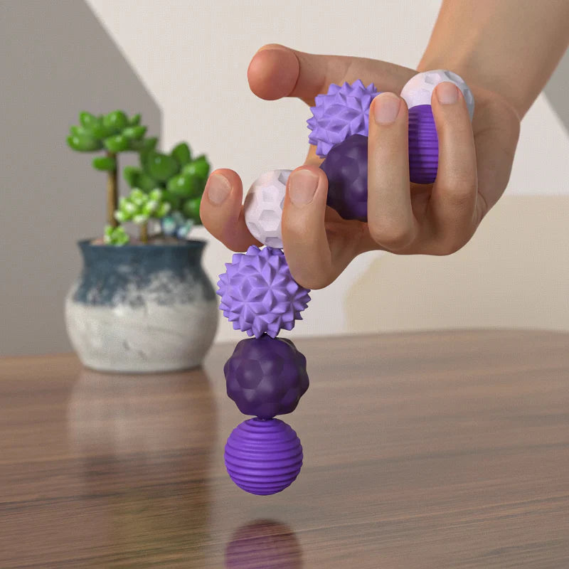 Hand holding magnetic silicone sensory toy, demonstrating its flexible and tactile nature.