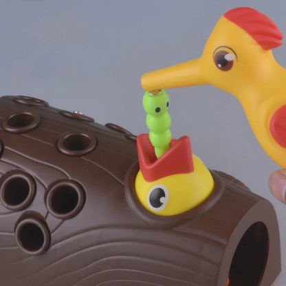 Toddler playing with Magnetic Woodpecker Game, enhancing fine motor skills & coordination