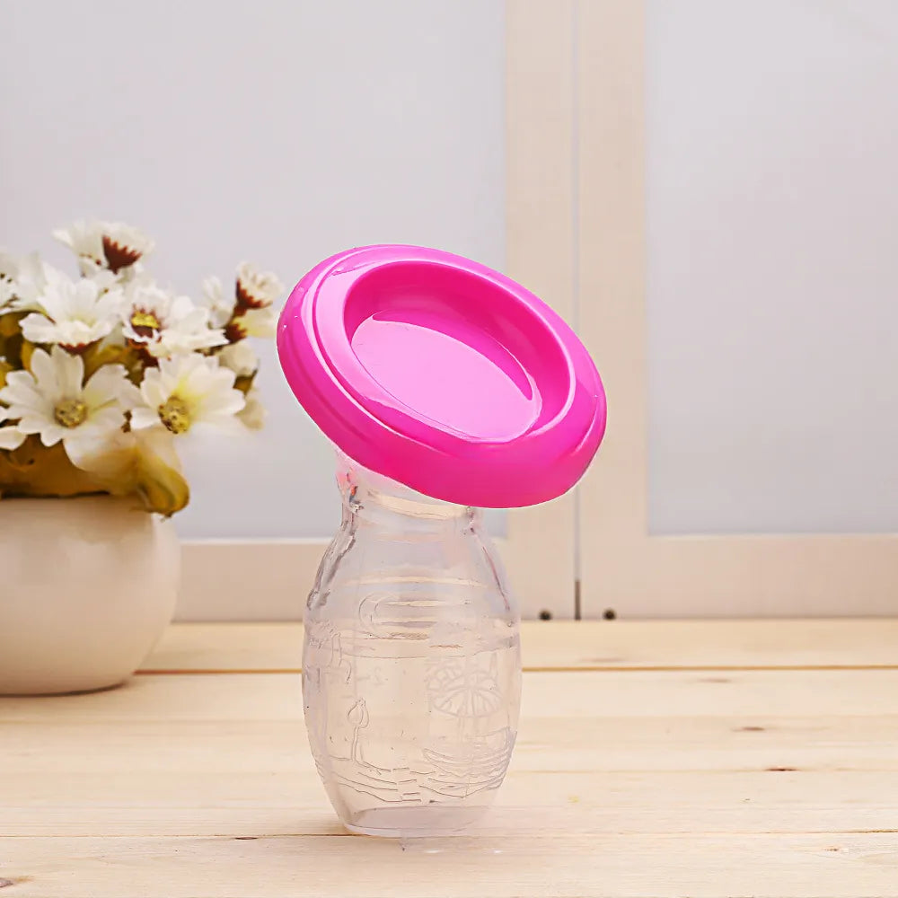Manual silicone breast pump shown with its protective lid, hygienic milk storage