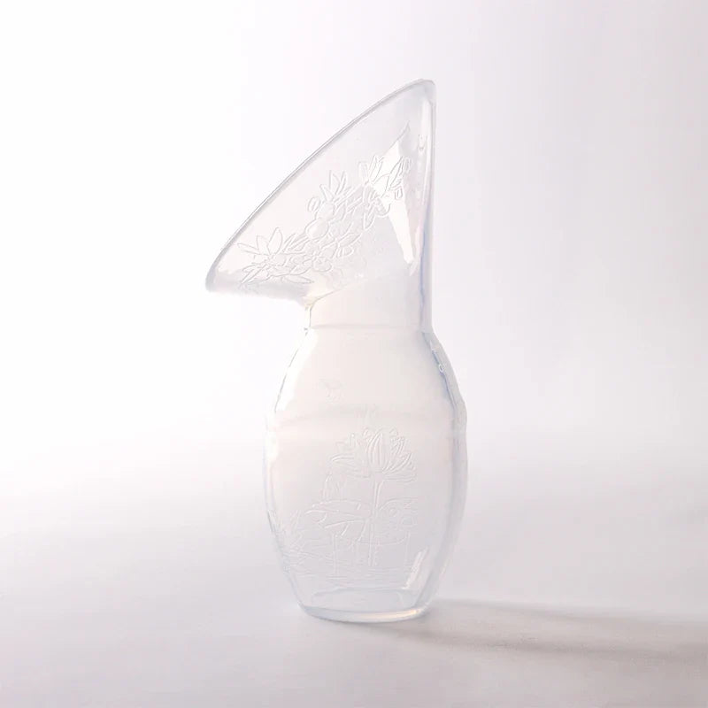 Silicone breast pump shown with lid, ideal for discreet and on-the-go milk collection