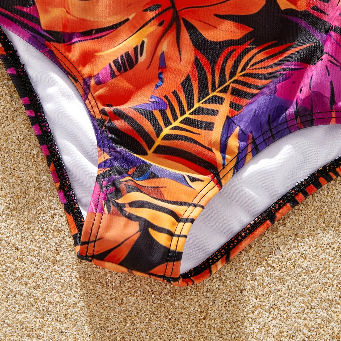Girl's floral bikini, front view. Adorable kids' tropical swimwear.