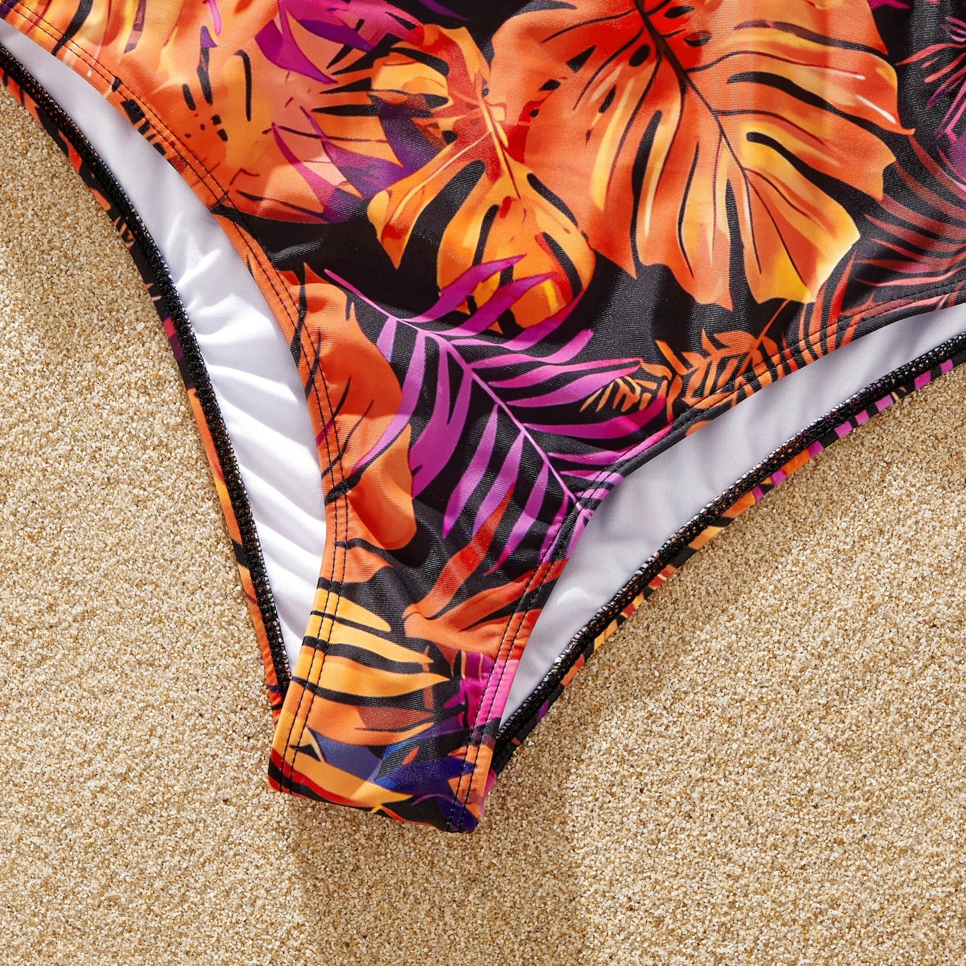 Mother & daughter matching floral bikinis for stylish summer fashion.