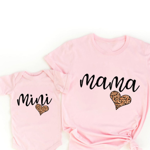 Family photo featuring matching rainbow cotton outfits for women and baby