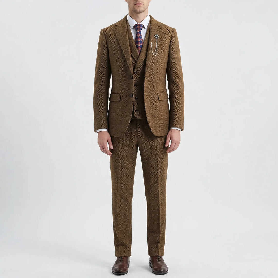 Man in a sophisticated 3-piece herringbone suit, ready for a special occasion or important business meeting.