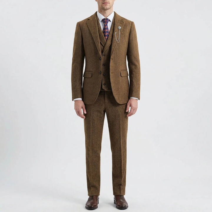 Man in a sophisticated 3-piece herringbone suit, ready for a special occasion or important business meeting.