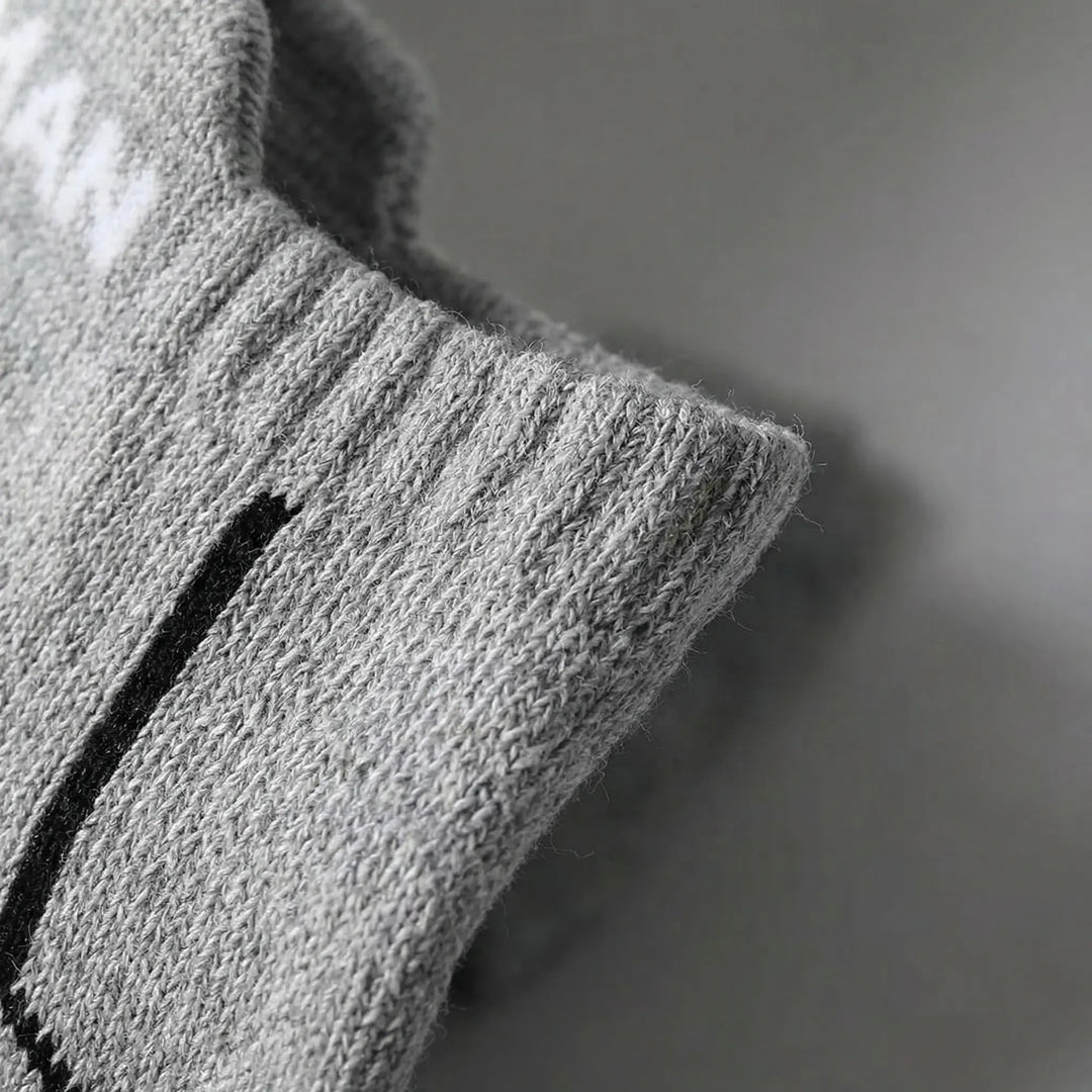 Close-up of men's low-cut athletic socks (6-pack). Designed for breathability & comfort during sports.