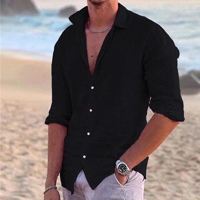 Man in a breathable long sleeve button-down shirt. Airy summer top, perfect for casual warm weather travel outfits.