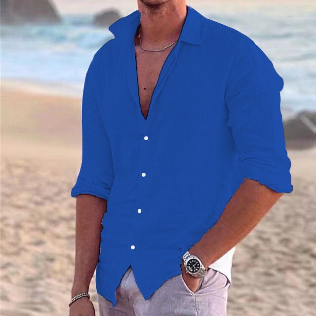 Folded solid color men's long sleeve button-down shirt. Breathable summer top for casual warm weather outfits.