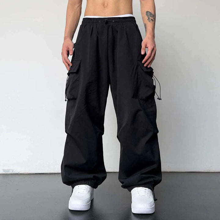 Men's casual wide leg utility cargo parachute pants. Comfortable loose fit for street style & Y2K fashion.