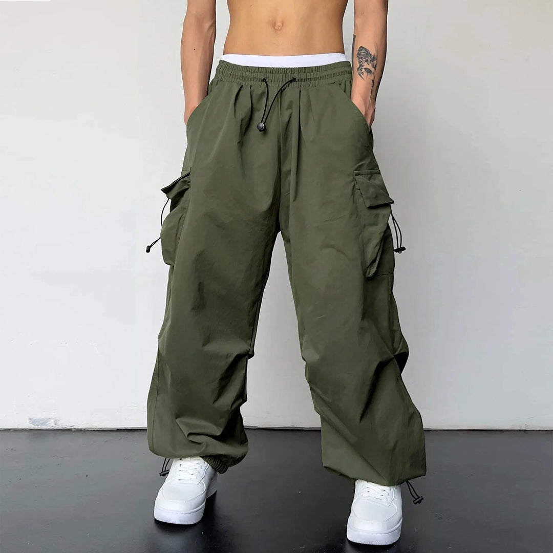 Trendy men's baggy parachute cargo pants for a loose fit & comfortable Y2K street style. Wide leg design.