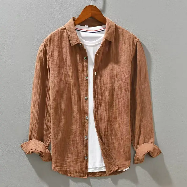 Green men's lightweight button-up shirt. Breathable & relaxed fit for comfortable summer wear.