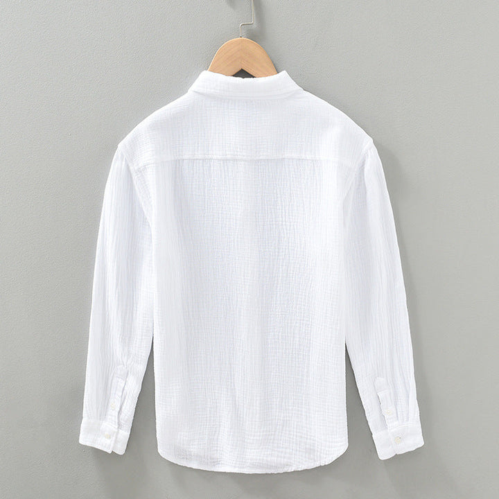 White men's lightweight button-up shirt. Breathable & relaxed fit, great for summer everyday style.