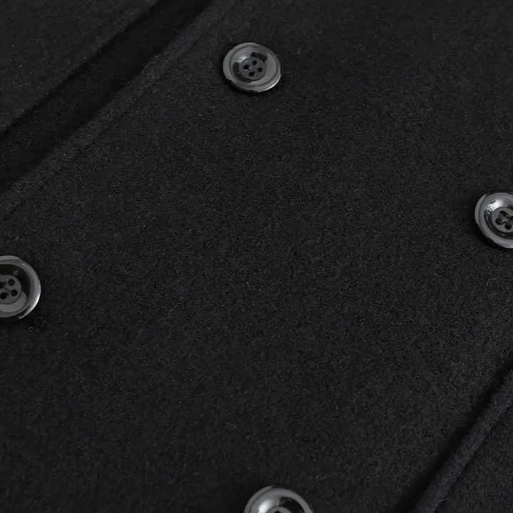 Classic men's black double-breasted winter coat. Tailored long overcoat for sophisticated men's fashion & outerwear.