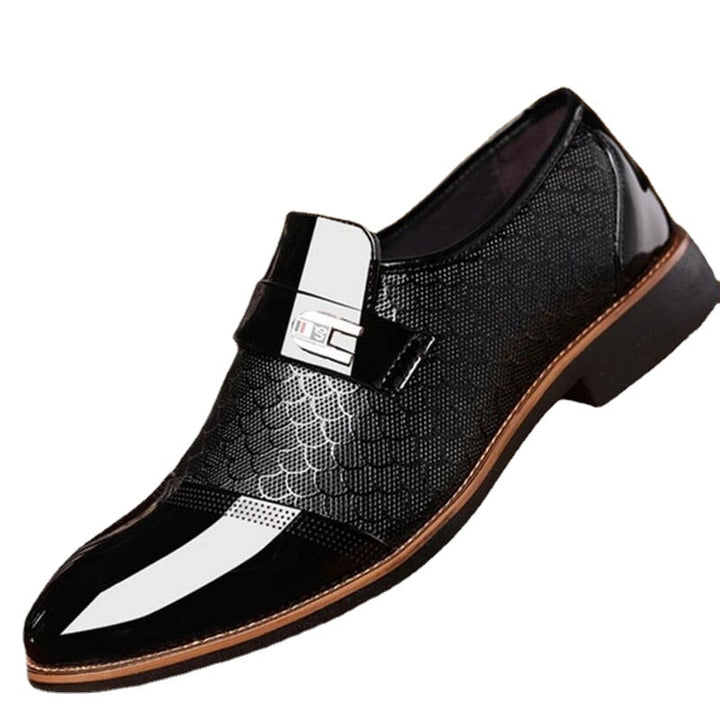 Detailed view of men's patent dress shoes with a sophisticated buckle. Modern formal footwear for weddings & business events.